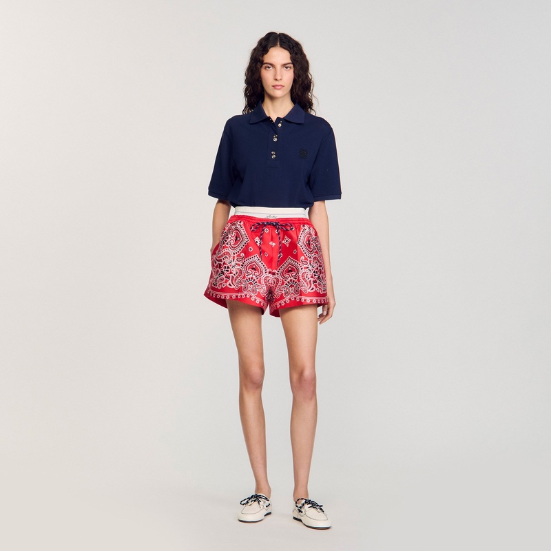 Polo shirt with decorative buttons