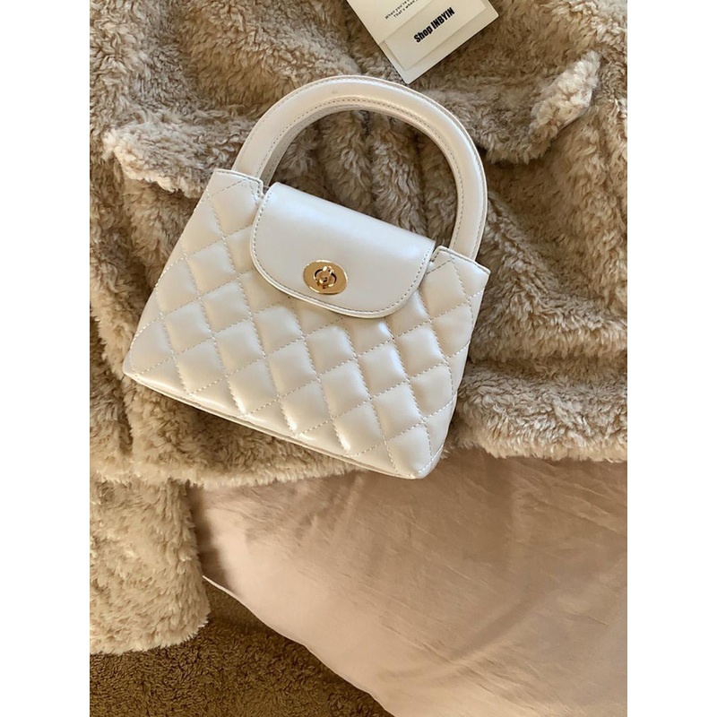 StyleCast x Revolte Swagger Sling Bag