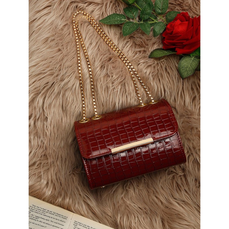 DressBerry Maroon Textured Structured Sling Bag with Fringed