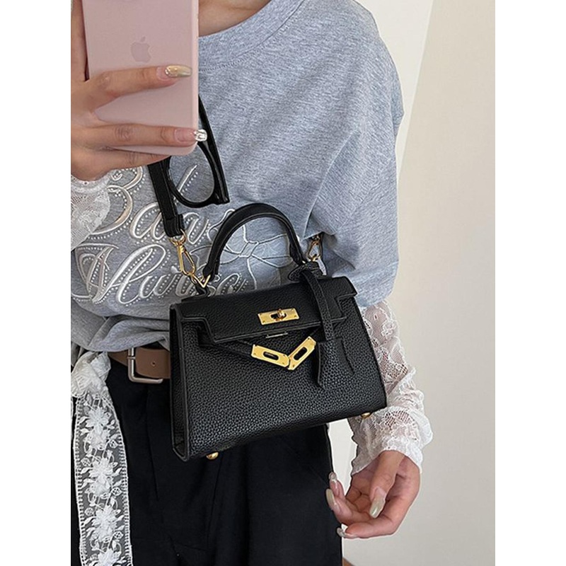 StyleCast x Revolte Swagger Handheld Bag